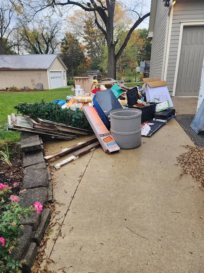 Dumpster being loaded with debris for Residential Dumpster Rental in Lake Royale